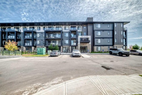 1409-3700 Seton Avenue Se, Calgary, AB - Outdoor With Balcony With Facade