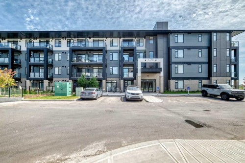 1409-3700 Seton Avenue Se, Calgary, AB - Outdoor With Balcony With Facade