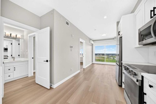 1409-3700 Seton Avenue Se, Calgary, AB - Indoor Photo Showing Kitchen