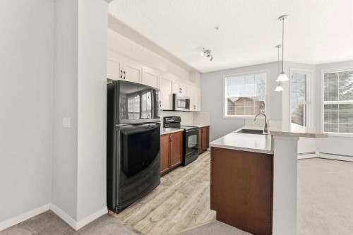 137-1 Crystal Green Lane, Okotoks, AB - Indoor Photo Showing Kitchen