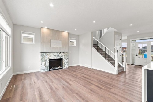 40 Fieldstone Close, Balzac, AB - Indoor Photo Showing Living Room With Fireplace