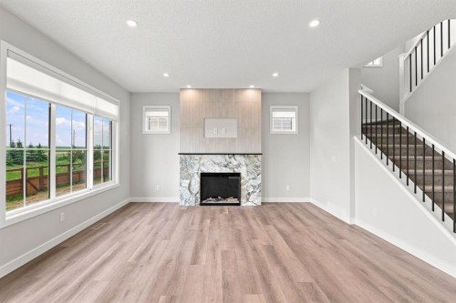 40 Fieldstone Close, Balzac, AB - Indoor Photo Showing Living Room With Fireplace