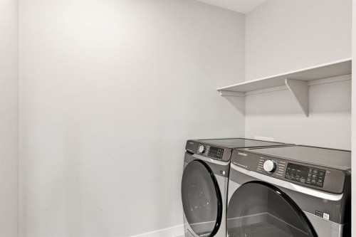40 Fieldstone Close, Balzac, AB - Indoor Photo Showing Laundry Room