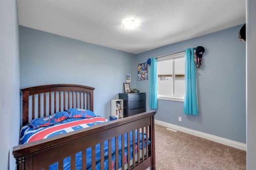 134 Channelside Cove Sw, Airdrie, AB - Indoor Photo Showing Bedroom