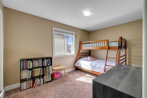 134 Channelside Cove Sw, Airdrie, AB - Indoor Photo Showing Bedroom
