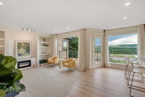 78 Scimitar View Nw, Calgary, AB - Indoor Photo Showing Living Room With Fireplace
