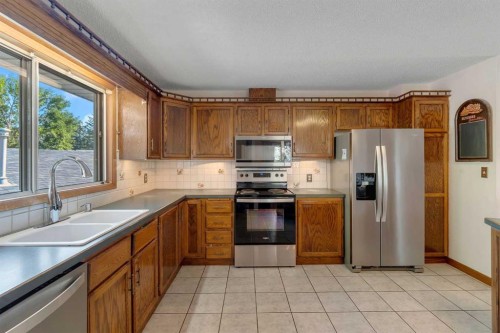36 Mckerrell Court Se, Calgary, AB - Indoor Photo Showing Kitchen With Stainless Steel Kitchen With Double Sink