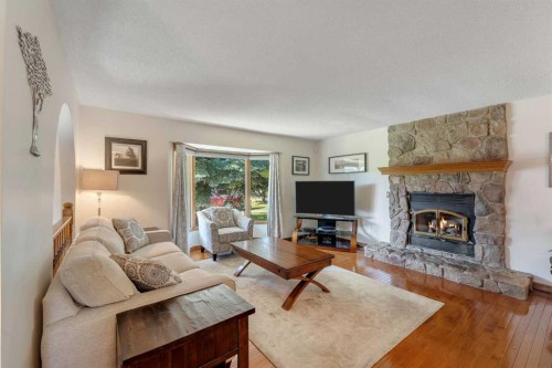 36 Mckerrell Court Se, Calgary, AB - Indoor Photo Showing Living Room With Fireplace