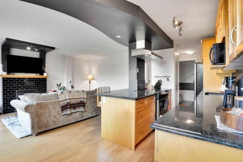 302-1225 15 Avenue Sw, Calgary, AB - Indoor With Fireplace