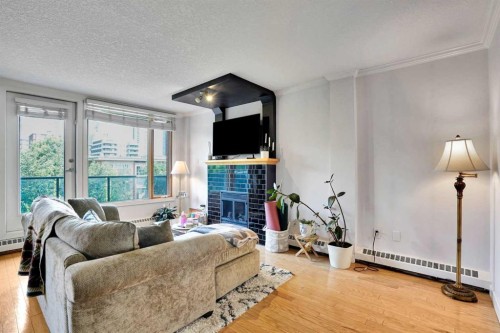 302-1225 15 Avenue Sw, Calgary, AB - Indoor Photo Showing Living Room With Fireplace