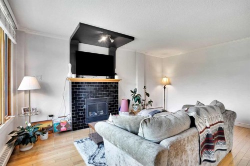 302-1225 15 Avenue Sw, Calgary, AB - Indoor Photo Showing Living Room With Fireplace