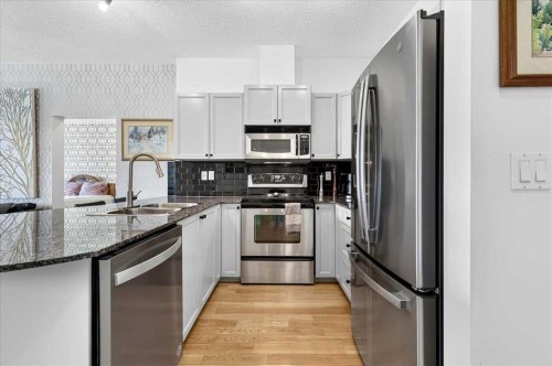 3404-11811 Lake Fraser Drive Se, Calgary, AB - Indoor Photo Showing Kitchen With Double Sink