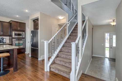 128 Sunset Park, Cochrane, AB - Indoor Photo Showing Kitchen