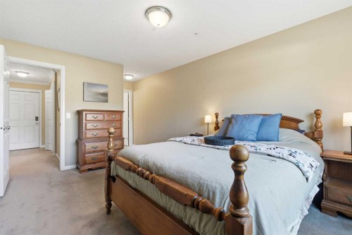 103-128 Centre Avenue, Cochrane, AB - Indoor Photo Showing Bedroom