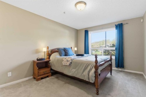103-128 Centre Avenue, Cochrane, AB - Indoor Photo Showing Bedroom