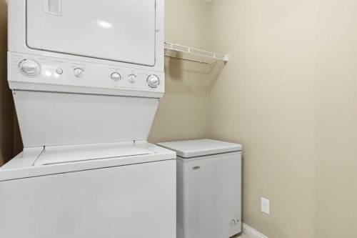 103-128 Centre Avenue, Cochrane, AB - Indoor Photo Showing Laundry Room