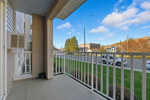 103-128 Centre Avenue, Cochrane, AB - Outdoor With Exterior
