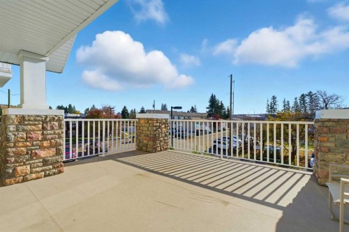 103-128 Centre Avenue, Cochrane, AB - Outdoor With Exterior