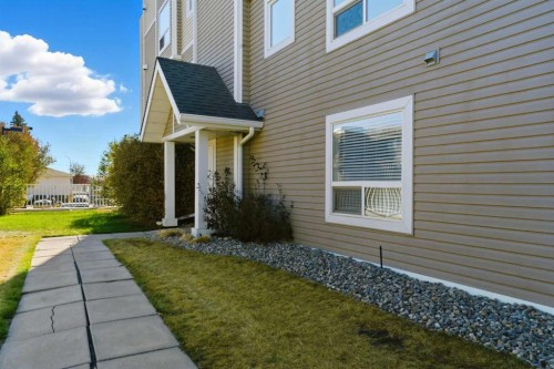 103-128 Centre Avenue, Cochrane, AB - Outdoor With Exterior