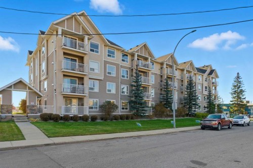 103-128 Centre Avenue, Cochrane, AB - Outdoor With Facade