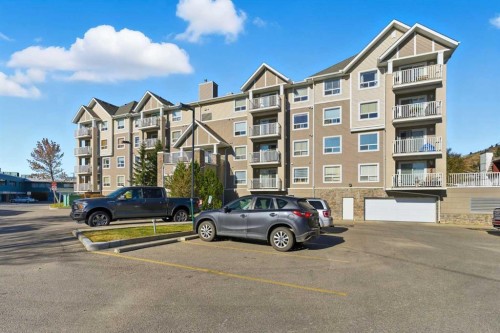 103-128 Centre Avenue, Cochrane, AB - Outdoor With Facade