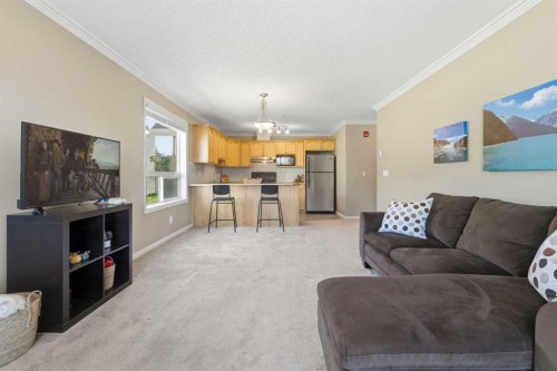 103-128 Centre Avenue, Cochrane, AB - Indoor Photo Showing Living Room