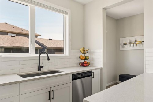 40 Magnolia Parade Se, Calgary, AB - Indoor Photo Showing Kitchen With Double Sink