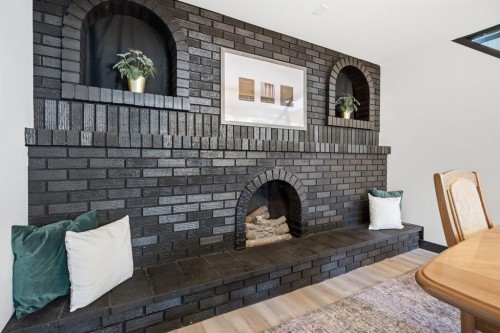 180 Huntford Road Ne, Calgary, AB - Indoor With Fireplace