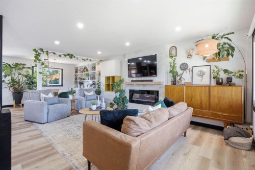 180 Huntford Road Ne, Calgary, AB - Indoor Photo Showing Living Room With Fireplace