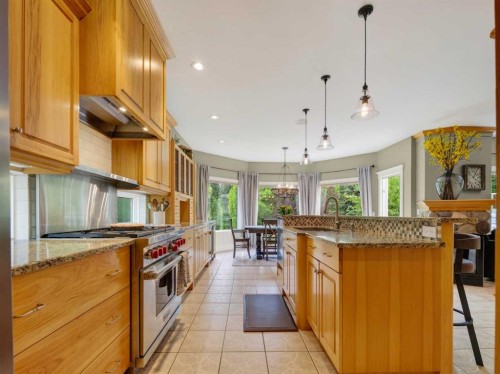 126 West Terrace Point, Cochrane, AB - Indoor Photo Showing Kitchen With Upgraded Kitchen