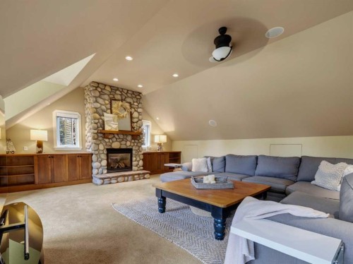 126 West Terrace Point, Cochrane, AB - Indoor Photo Showing Living Room With Fireplace