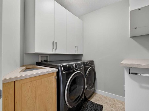 126 West Terrace Point, Cochrane, AB - Indoor Photo Showing Laundry Room