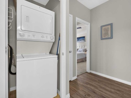 201-72 Quigley Drive, Cochrane, AB - Indoor Photo Showing Laundry Room