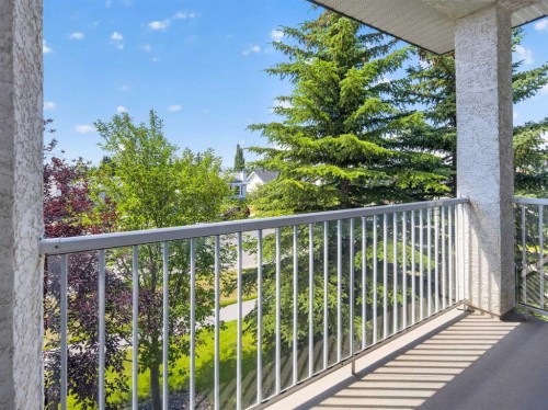201-72 Quigley Drive, Cochrane, AB - Outdoor With Balcony