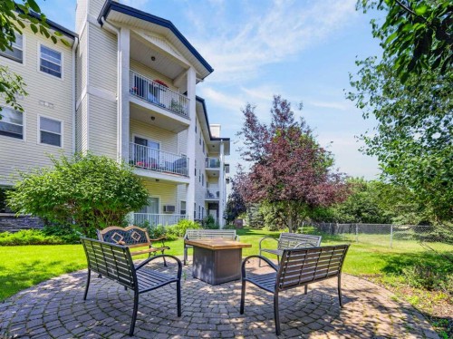 201-72 Quigley Drive, Cochrane, AB - Outdoor With Balcony