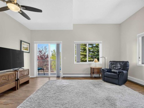 201-72 Quigley Drive, Cochrane, AB - Indoor Photo Showing Living Room