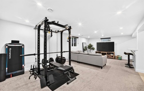 411 Woodland Crescent Se, Calgary, AB - Indoor Photo Showing Gym Room