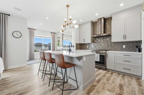 411 Rivercrest Boulevard, Cochrane, AB - Indoor Photo Showing Kitchen With Upgraded Kitchen