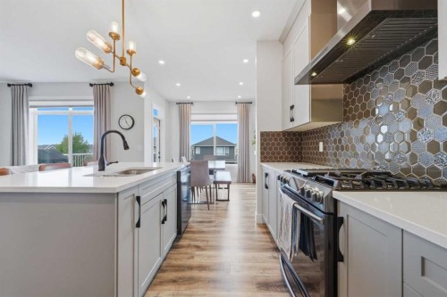 411 Rivercrest Boulevard, Cochrane, AB - Indoor Photo Showing Kitchen With Upgraded Kitchen