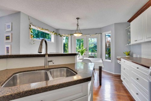 11 Mckenzie Lake View Se, Calgary, AB - Indoor Photo Showing Kitchen With Double Sink