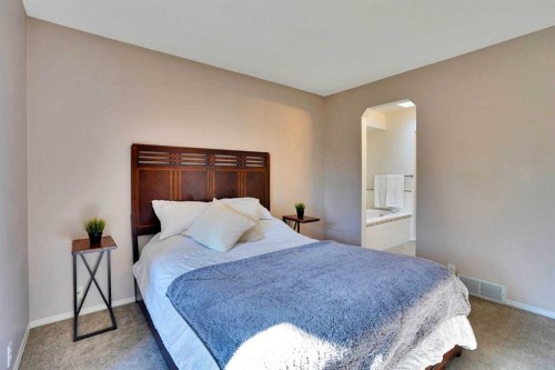 11 Mckenzie Lake View Se, Calgary, AB - Indoor Photo Showing Bedroom
