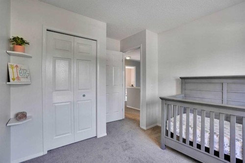11 Mckenzie Lake View Se, Calgary, AB - Indoor Photo Showing Bedroom