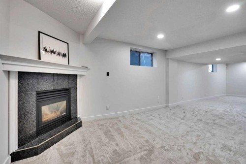 11 Mckenzie Lake View Se, Calgary, AB - Indoor With Fireplace