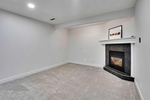 11 Mckenzie Lake View Se, Calgary, AB - Indoor With Fireplace
