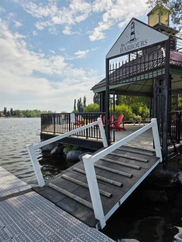 11 Mckenzie Lake View Se, Calgary, AB - Outdoor With Body Of Water