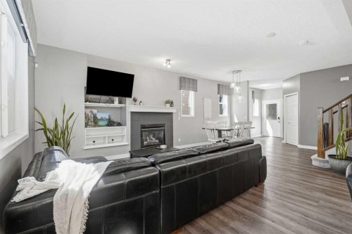 379 Cimarron Boulevard, Okotoks, AB - Indoor Photo Showing Living Room With Fireplace