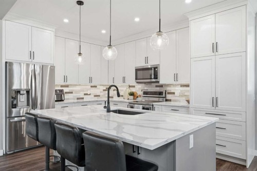 379 Cimarron Boulevard, Okotoks, AB - Indoor Photo Showing Kitchen With Upgraded Kitchen