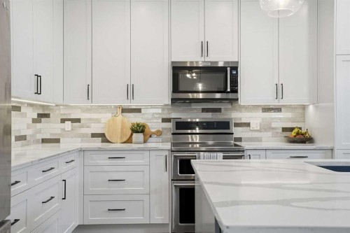 379 Cimarron Boulevard, Okotoks, AB - Indoor Photo Showing Kitchen With Upgraded Kitchen