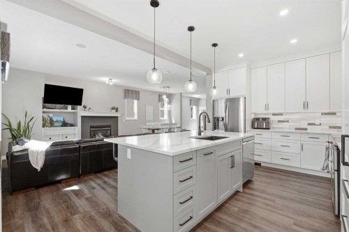 379 Cimarron Boulevard, Okotoks, AB - Indoor Photo Showing Kitchen With Upgraded Kitchen