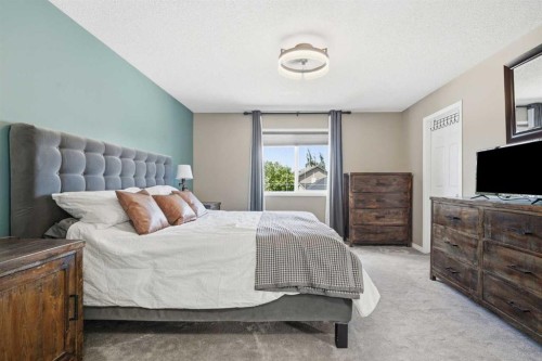 379 Cimarron Boulevard, Okotoks, AB - Indoor Photo Showing Bedroom